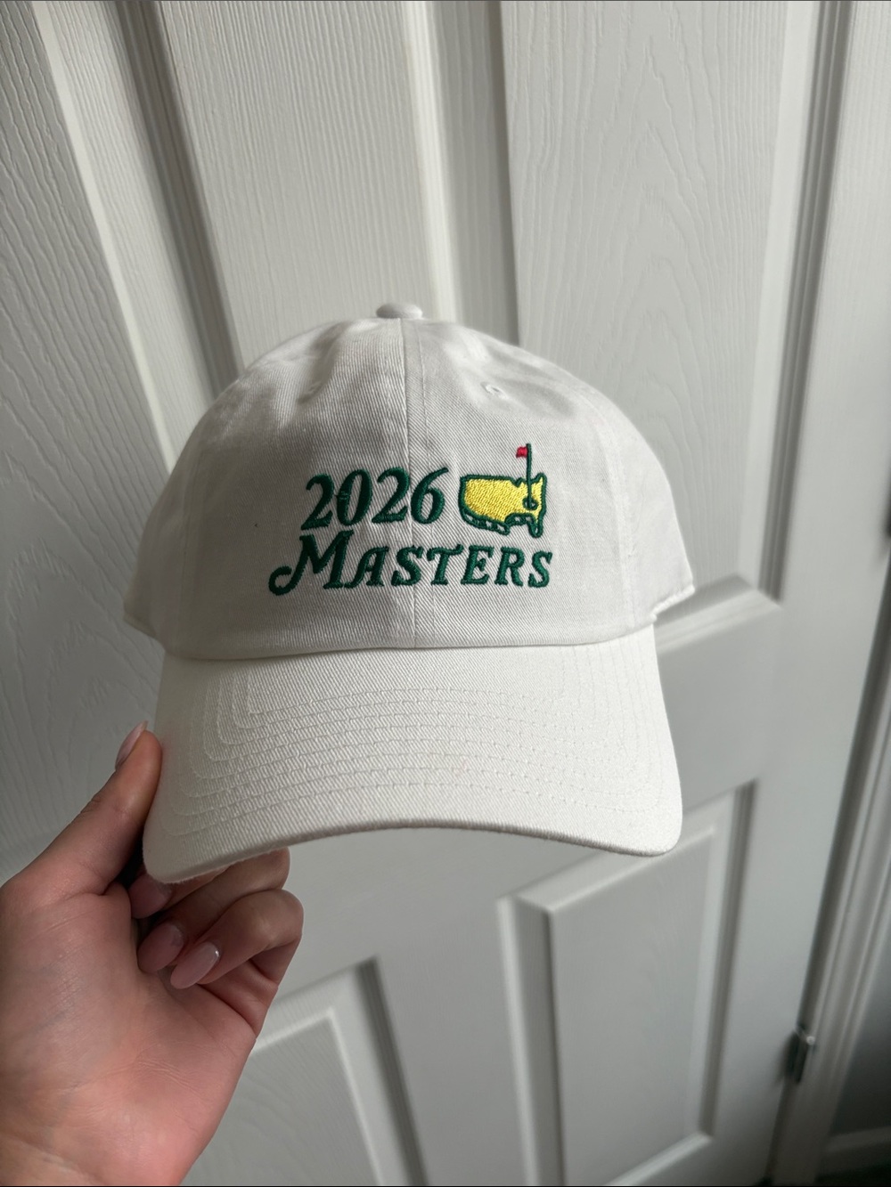 Masters White Cap with Yellow Masters Logo and Red Flag